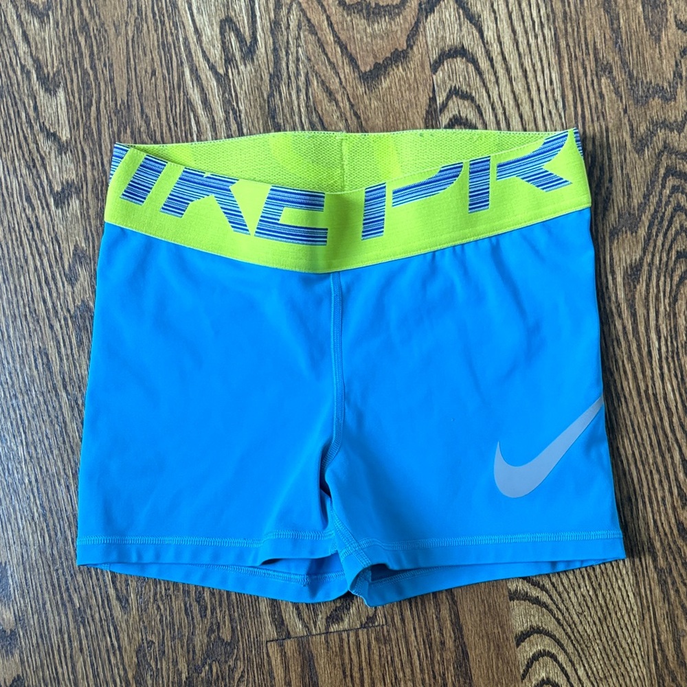 Nike Blue Shorts with green/yellowish Waistband